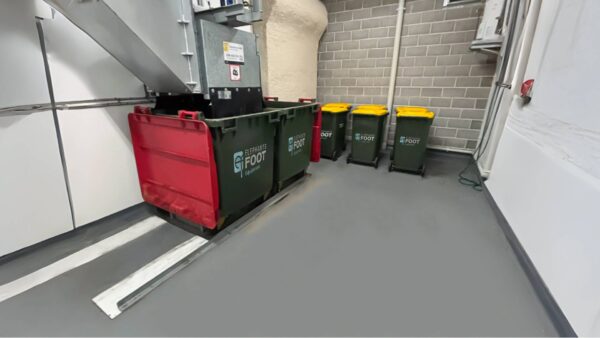 Restored waste room with general waste and recycling bins